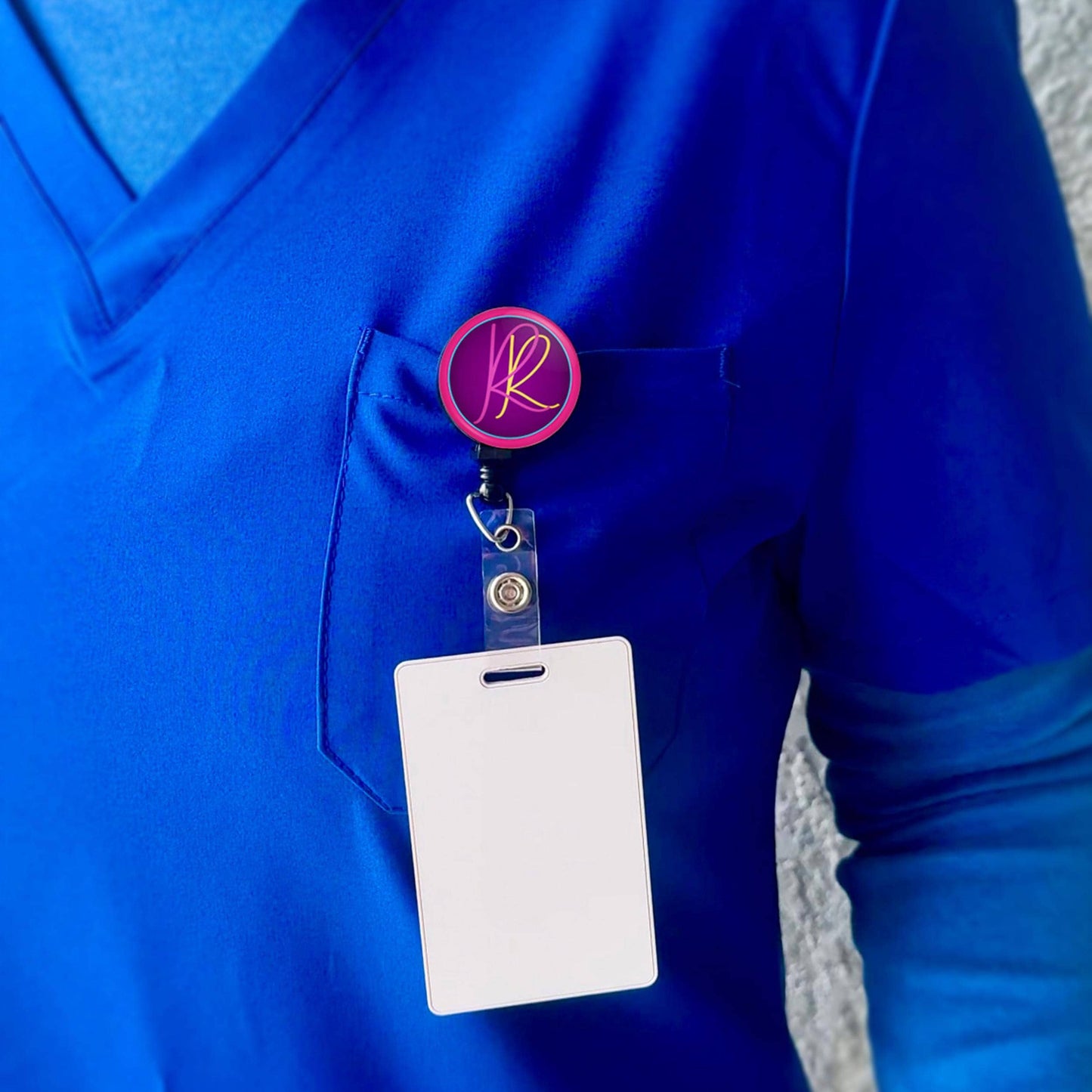 a person wearing a blue shirt with a badge and a name tag attached to it.