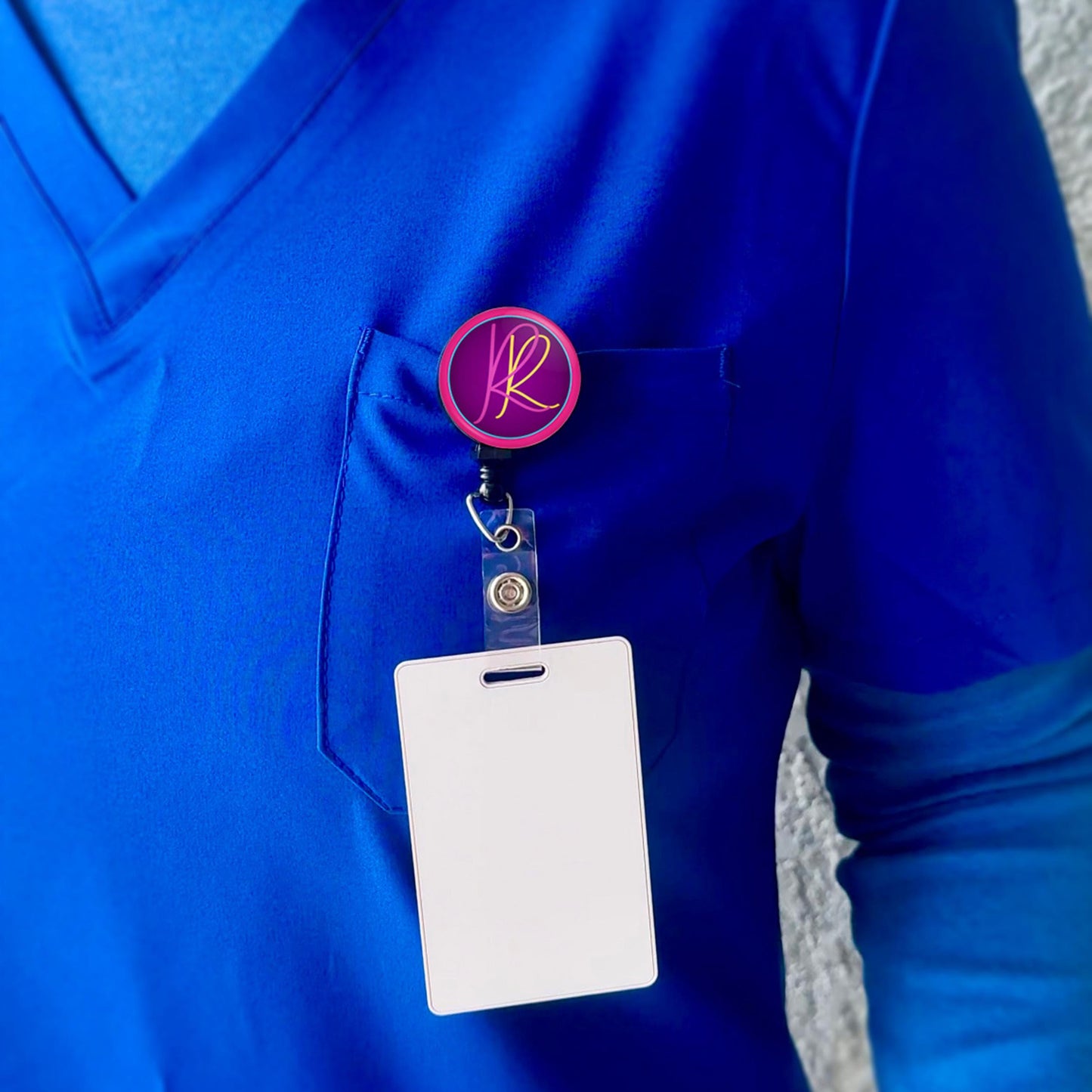 a person wearing a blue shirt with a badge and a name tag attached to it.