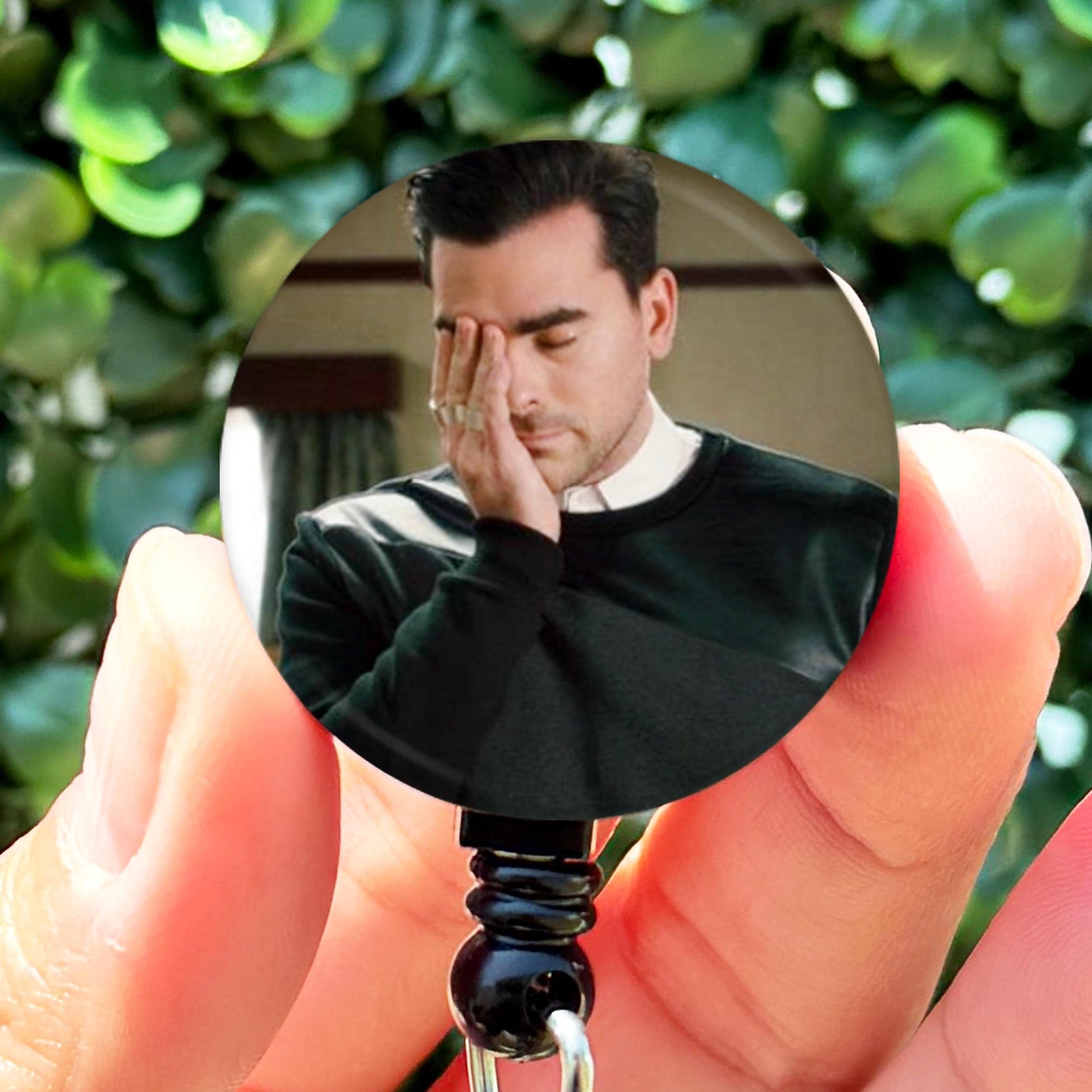 a man holding a key to his face