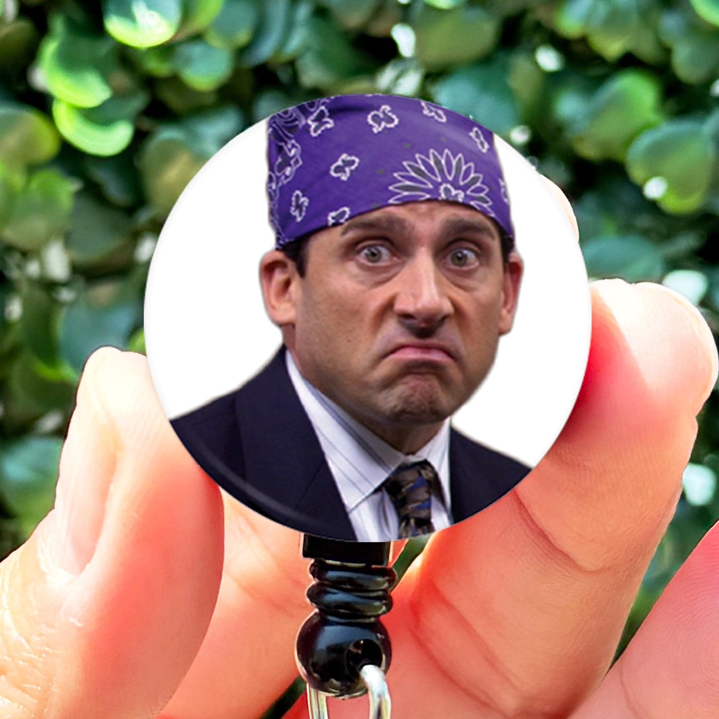 a man in a suit and tie holding a keychain