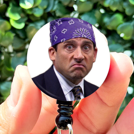 a man in a suit and tie holding a keychain