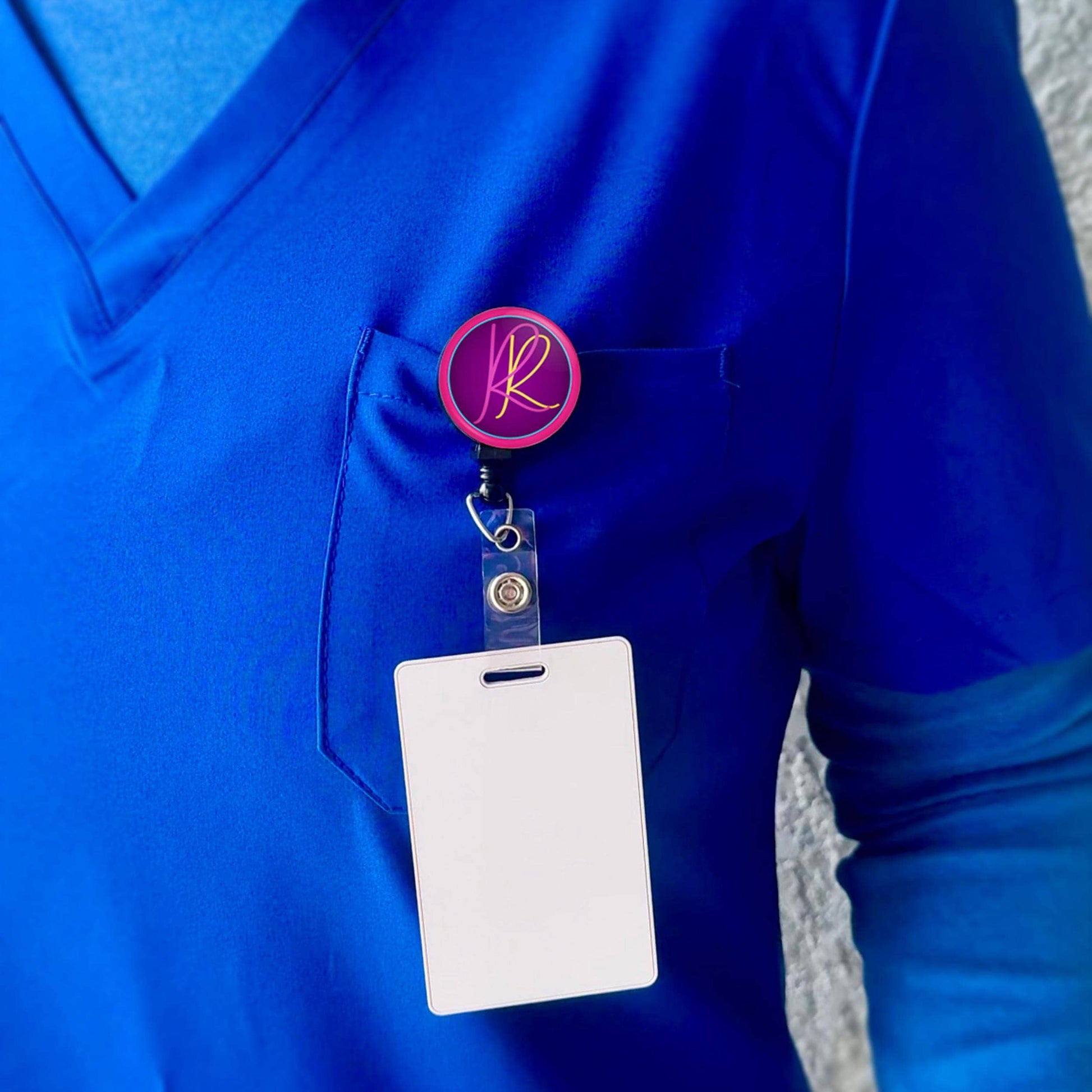 a person wearing a blue shirt with a badge and a name tag attached to it.